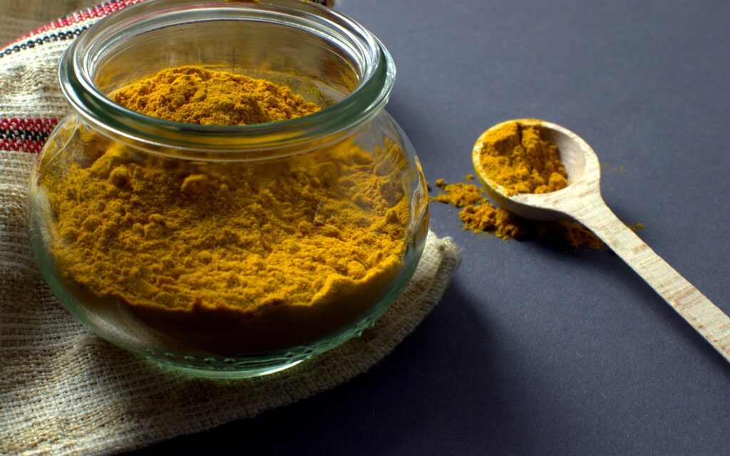 turmeric, manson jar, spoon