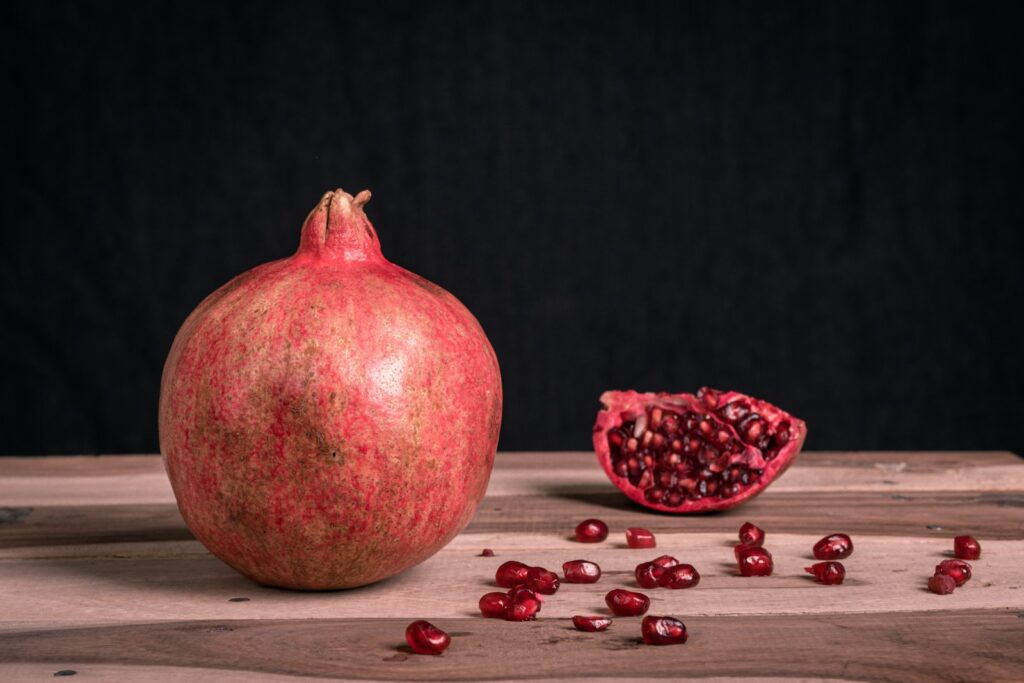 red round fruit on black surface